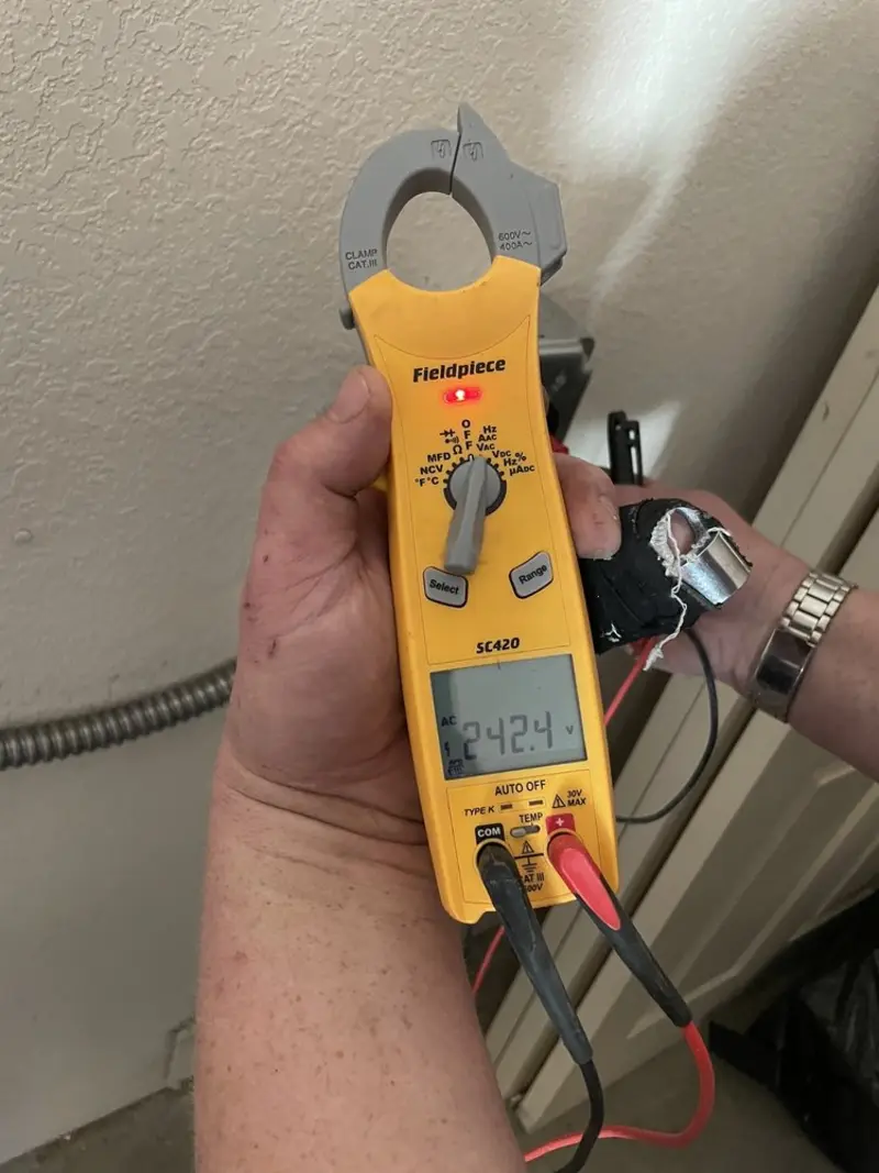 Voltage testing with clamp meter during Circuit Breaker Repair in Fox Crossing